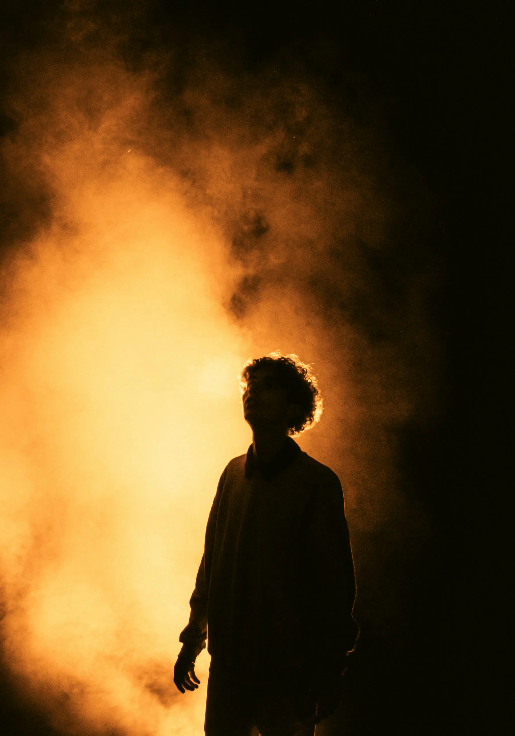 Silhouette against glowing smoke