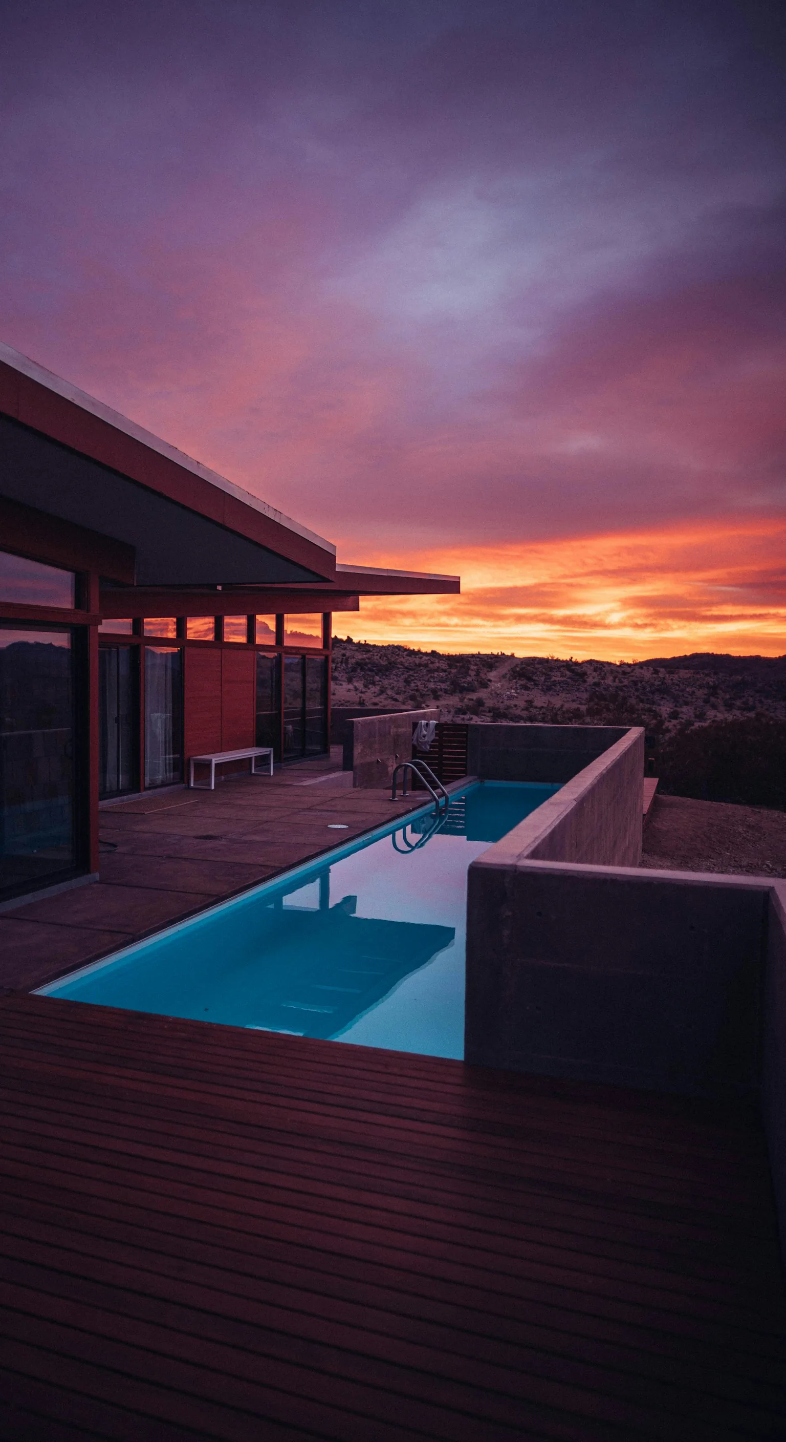 Modern house with a pool at sunset
