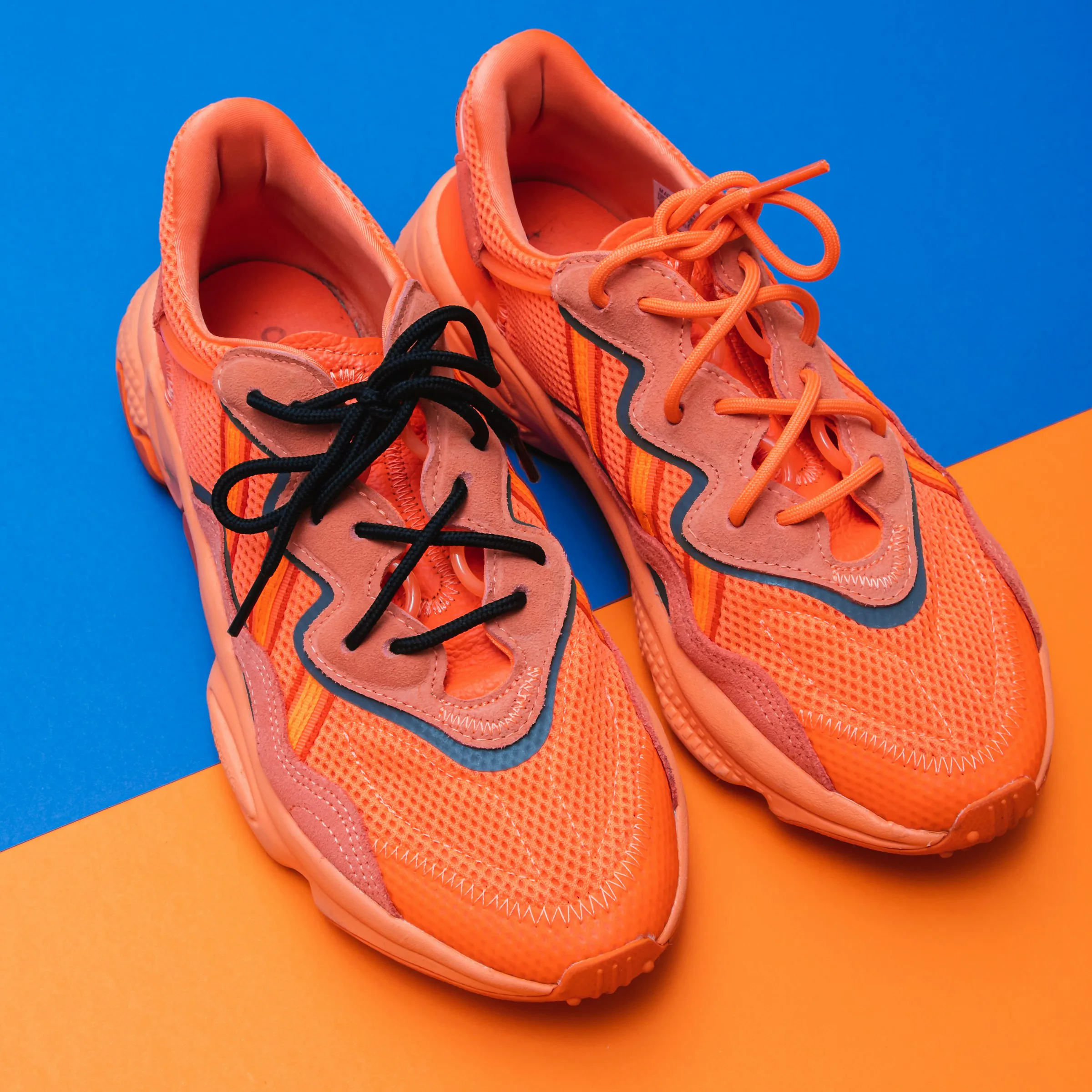 Orange trainers on a blue and orange set